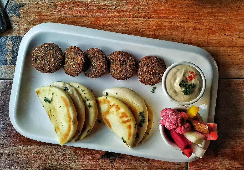 Emirati cuisine is based on simple, hearty ingredients like rice, meat (lamb, mutton, chicken, goat, and fish), and fragrant spices like saffron, cardamom, and cinnamon.